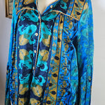 Blue patterned fabric on a mannequin with a neutral background