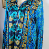 Blue patterned fabric on a mannequin with a neutral background