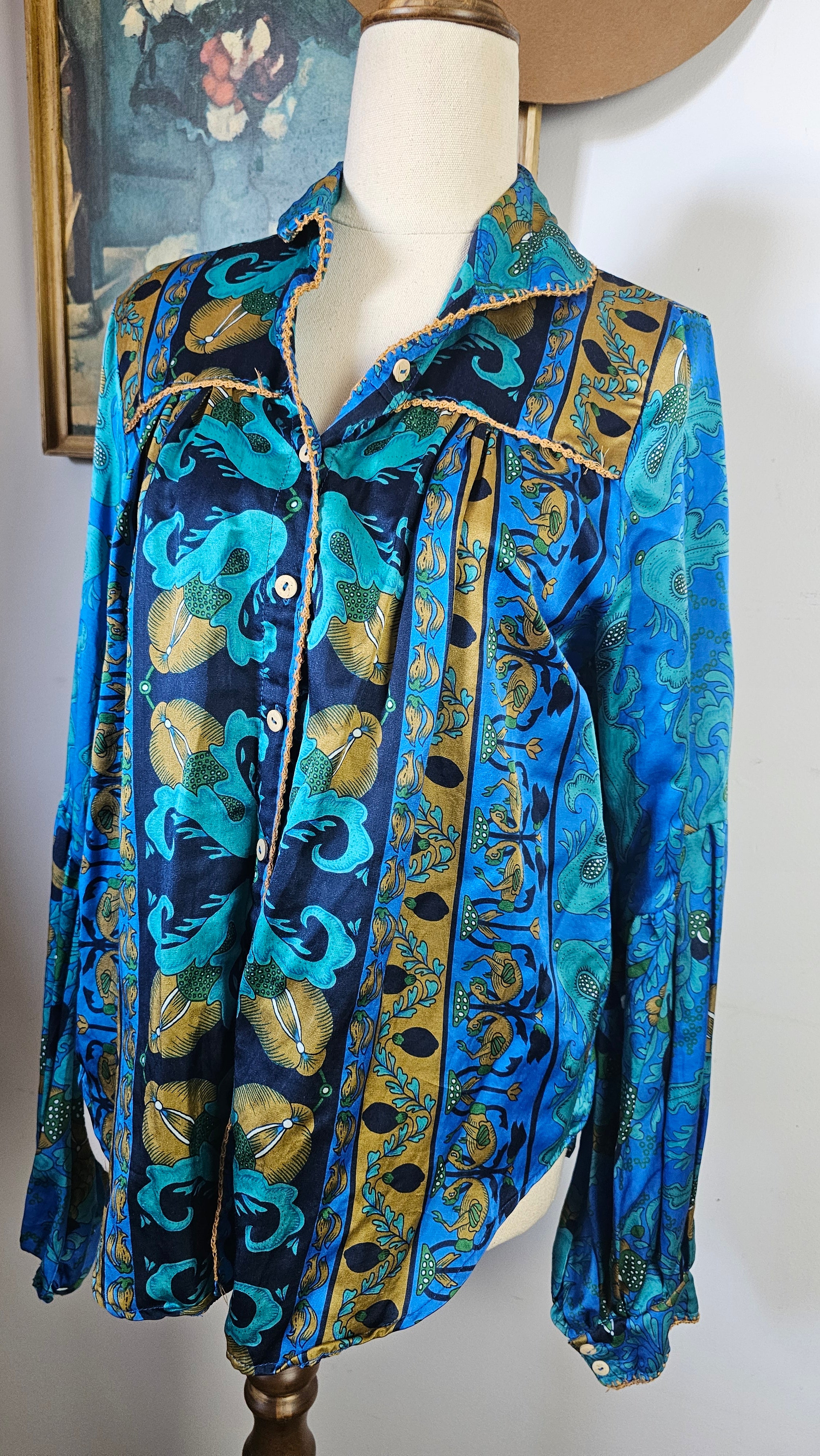 Blue patterned fabric on a mannequin with a neutral background