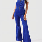 Person wearing a blue jumpsuit on a white background