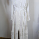 White dress on a mannequin against a white background