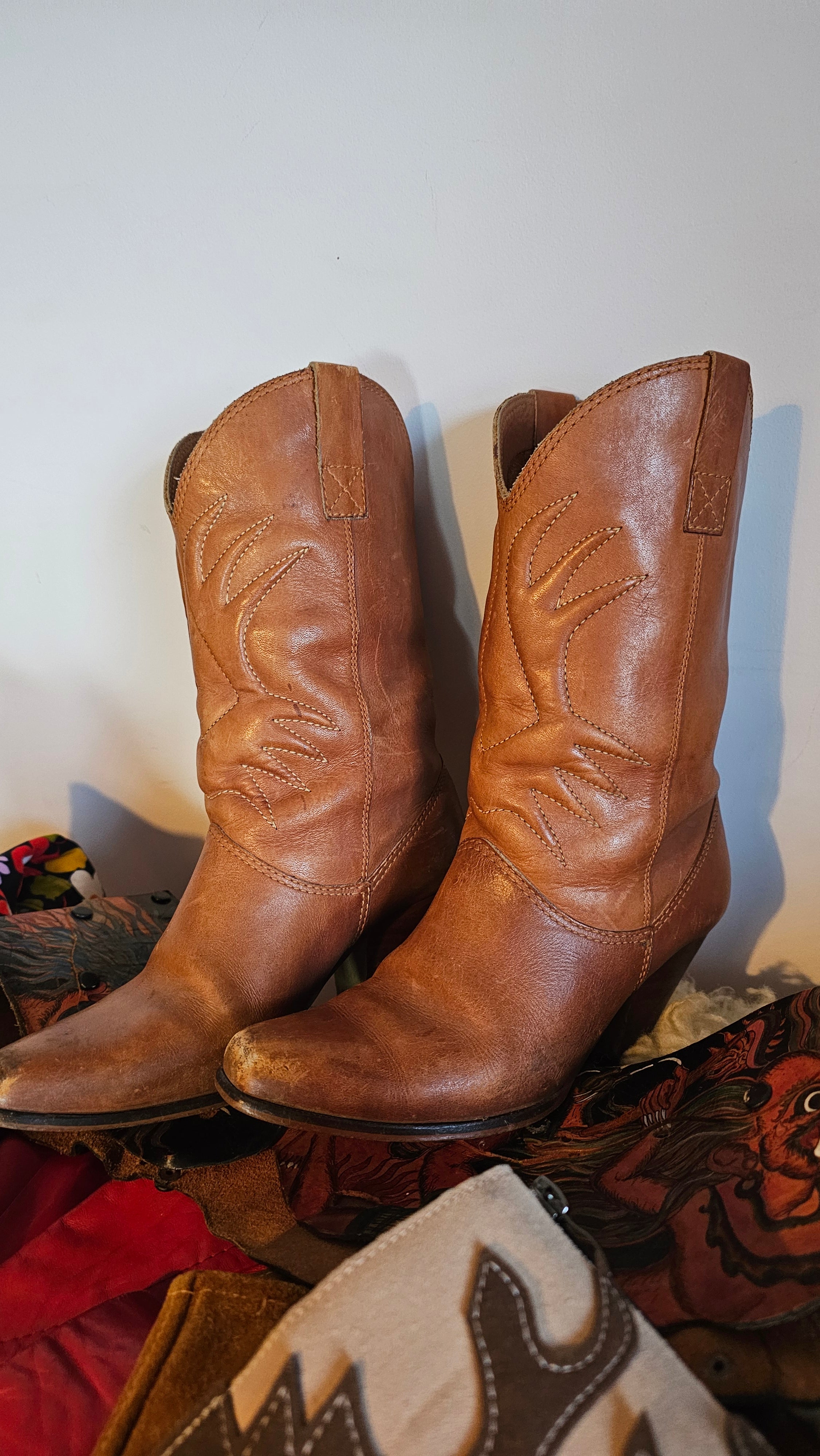 Pair of Vintage Brazilian Cowboy Boots - Size 7B in tan leather with pointed toes and pull tabs, perfect for Western-inspired outfits.