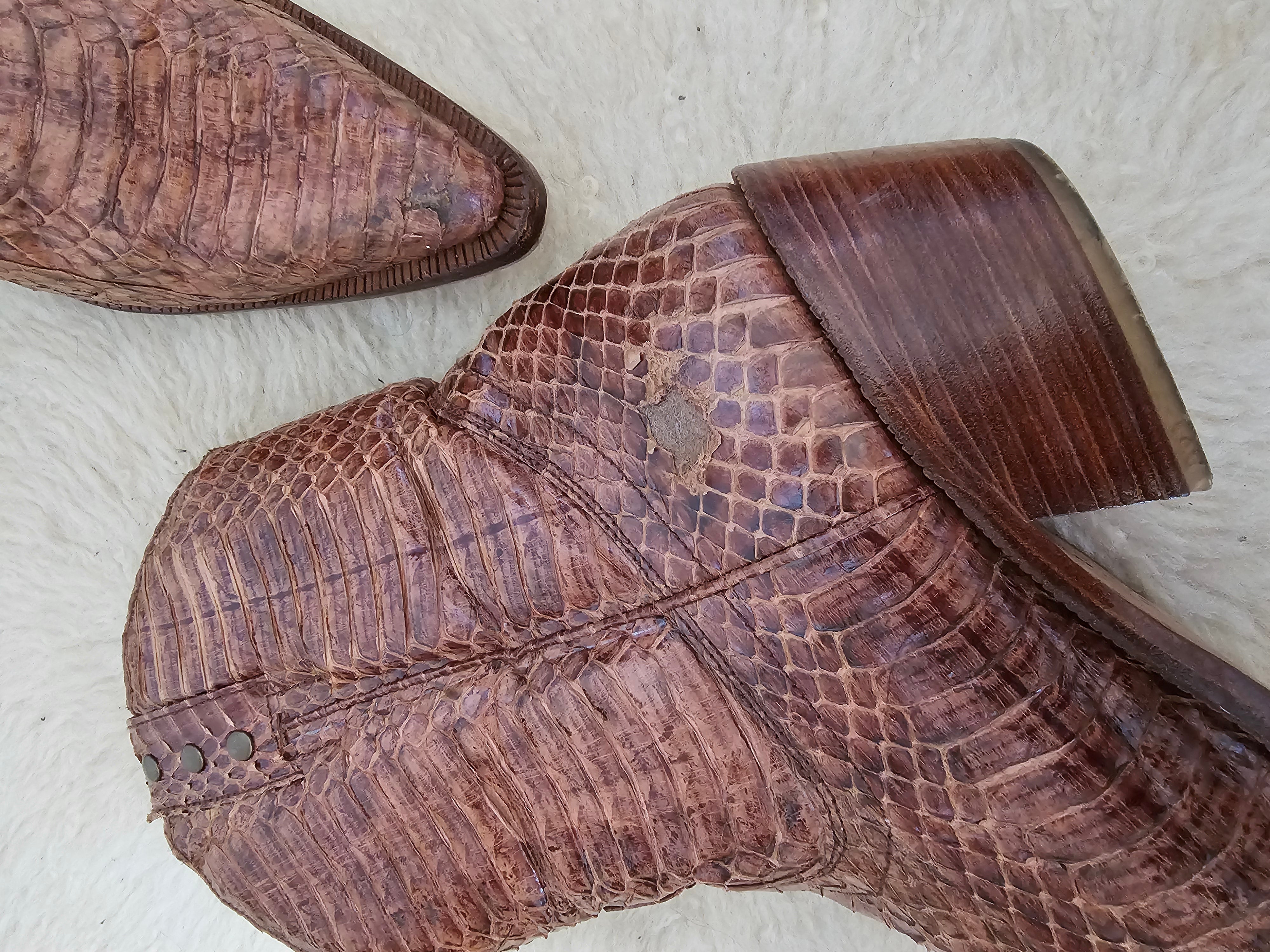Close-up of a brown leather shoe with a textured sole on a light background