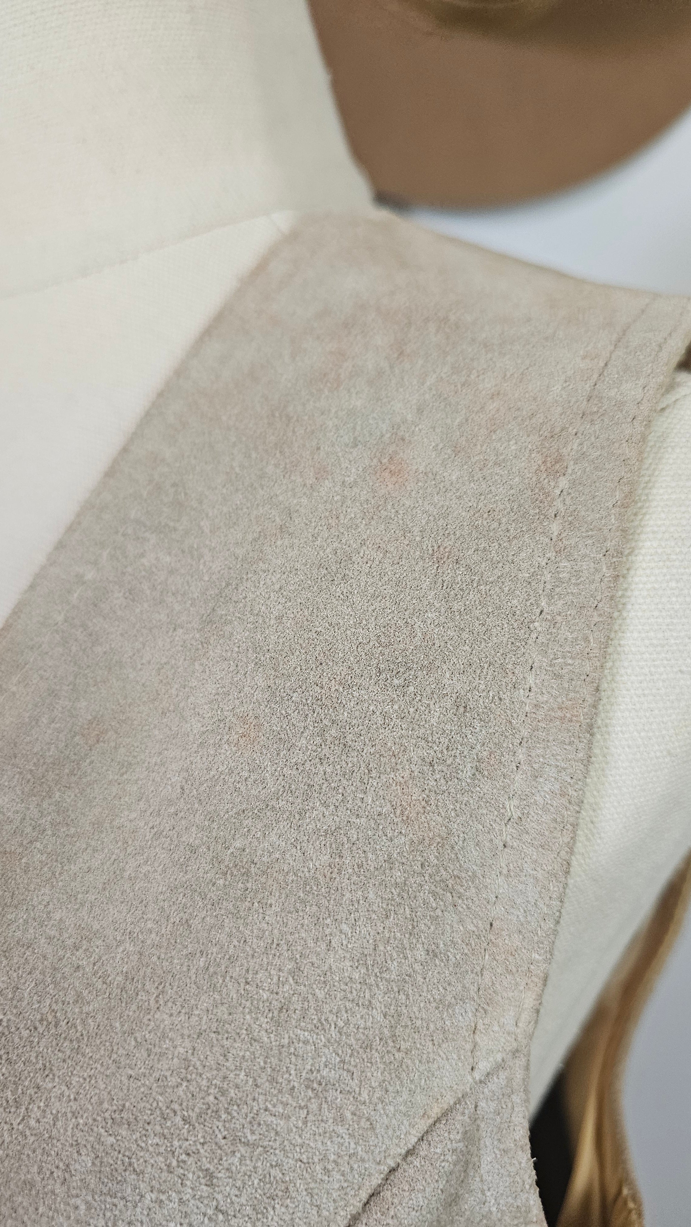 Close-up of a textured fabric surface on a mannequin