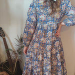 Back view of Property of Zephyr – Sienna Long Layer Dress on model, highlighting relaxed fit and detailed floral print, size small.