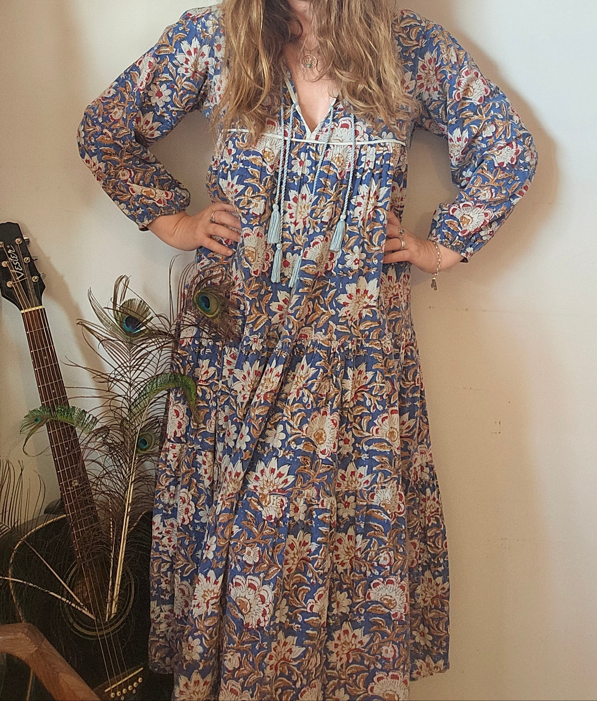 Model poses in Property of Zephyr – Sienna Long Layer Dress, showcasing boho style and relaxed fit with floral paisley print, size small.