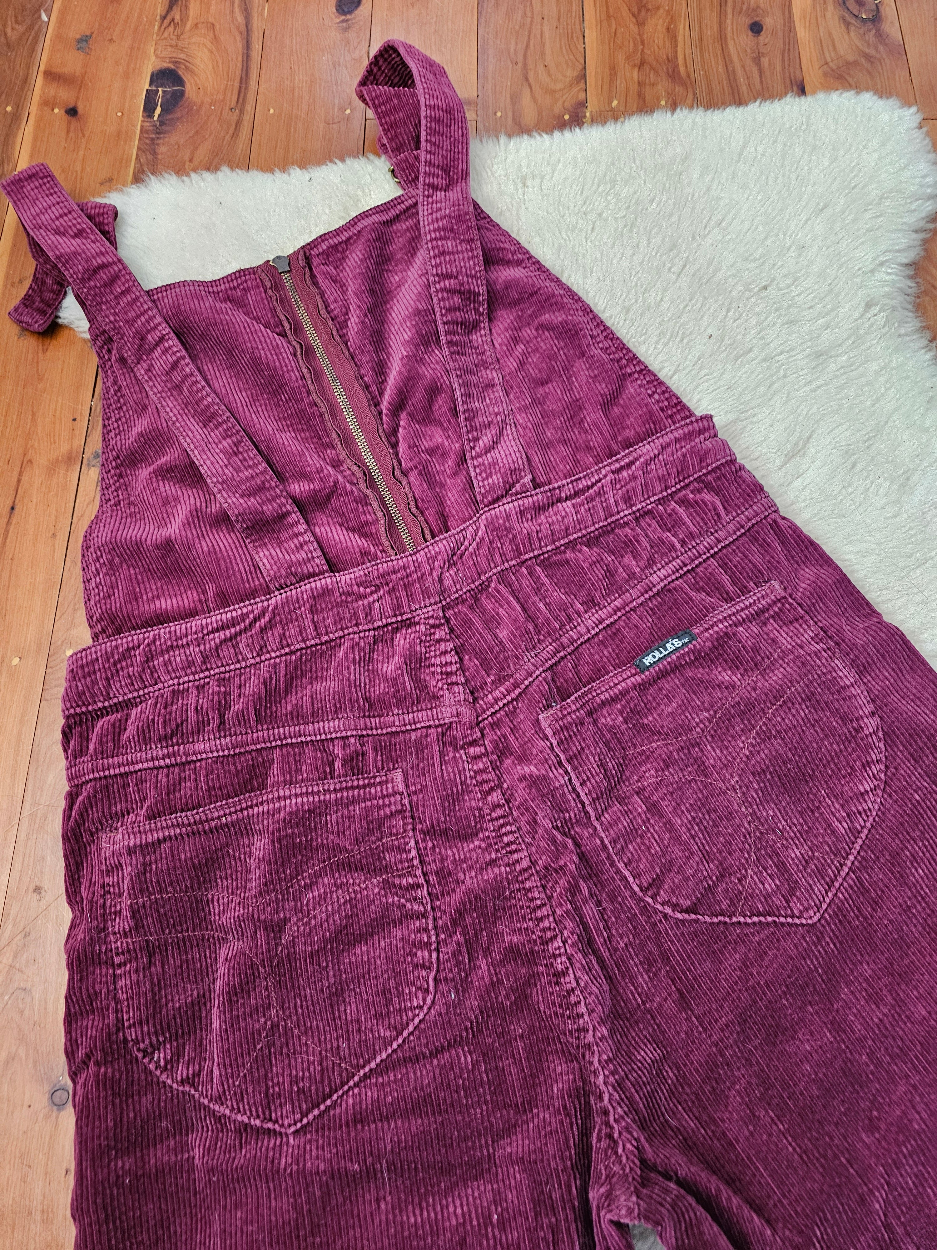 Purple corduroy dress on a wooden floor with a white rug underneath