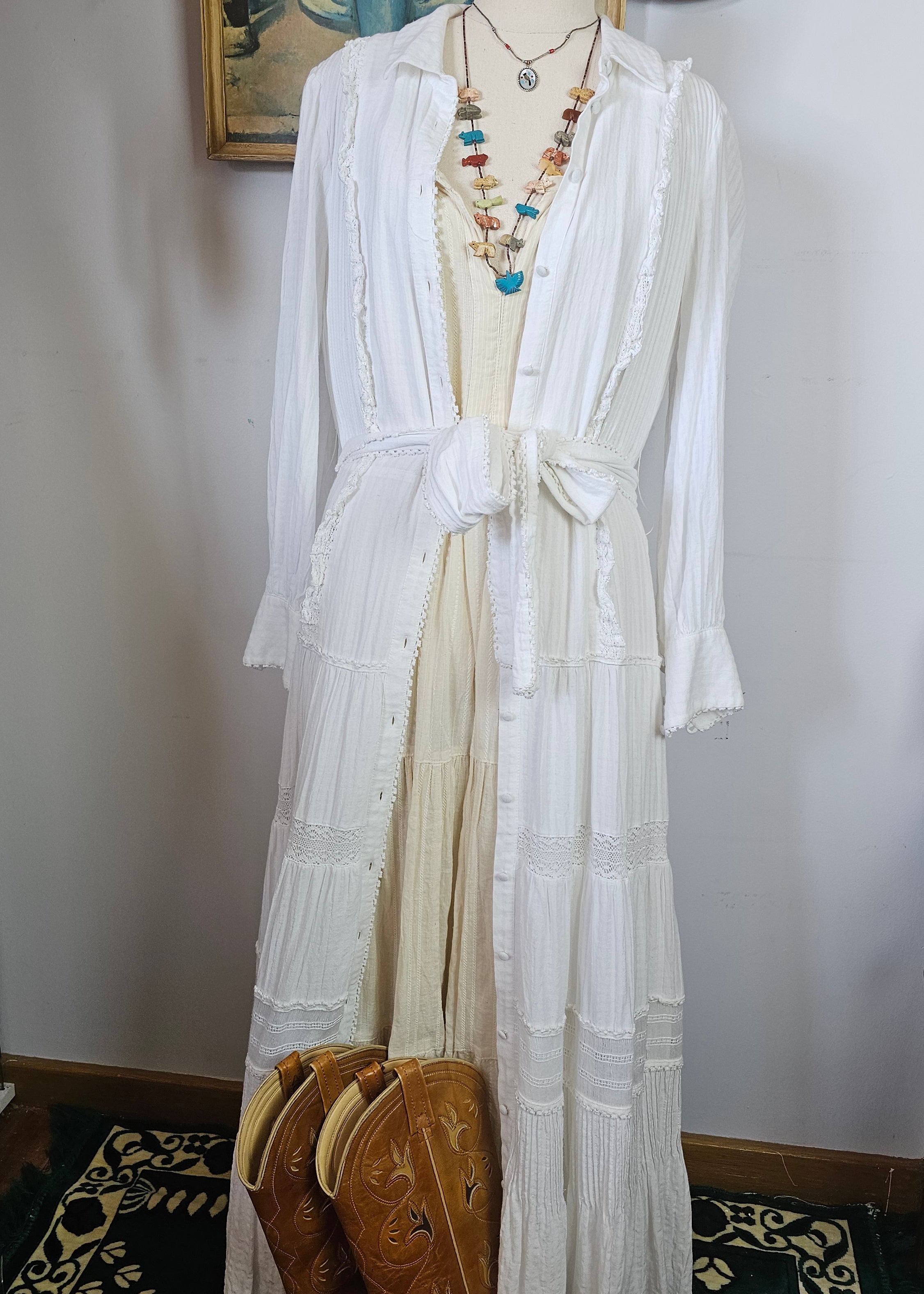 White fabric on a mannequin with decorative elements in the background