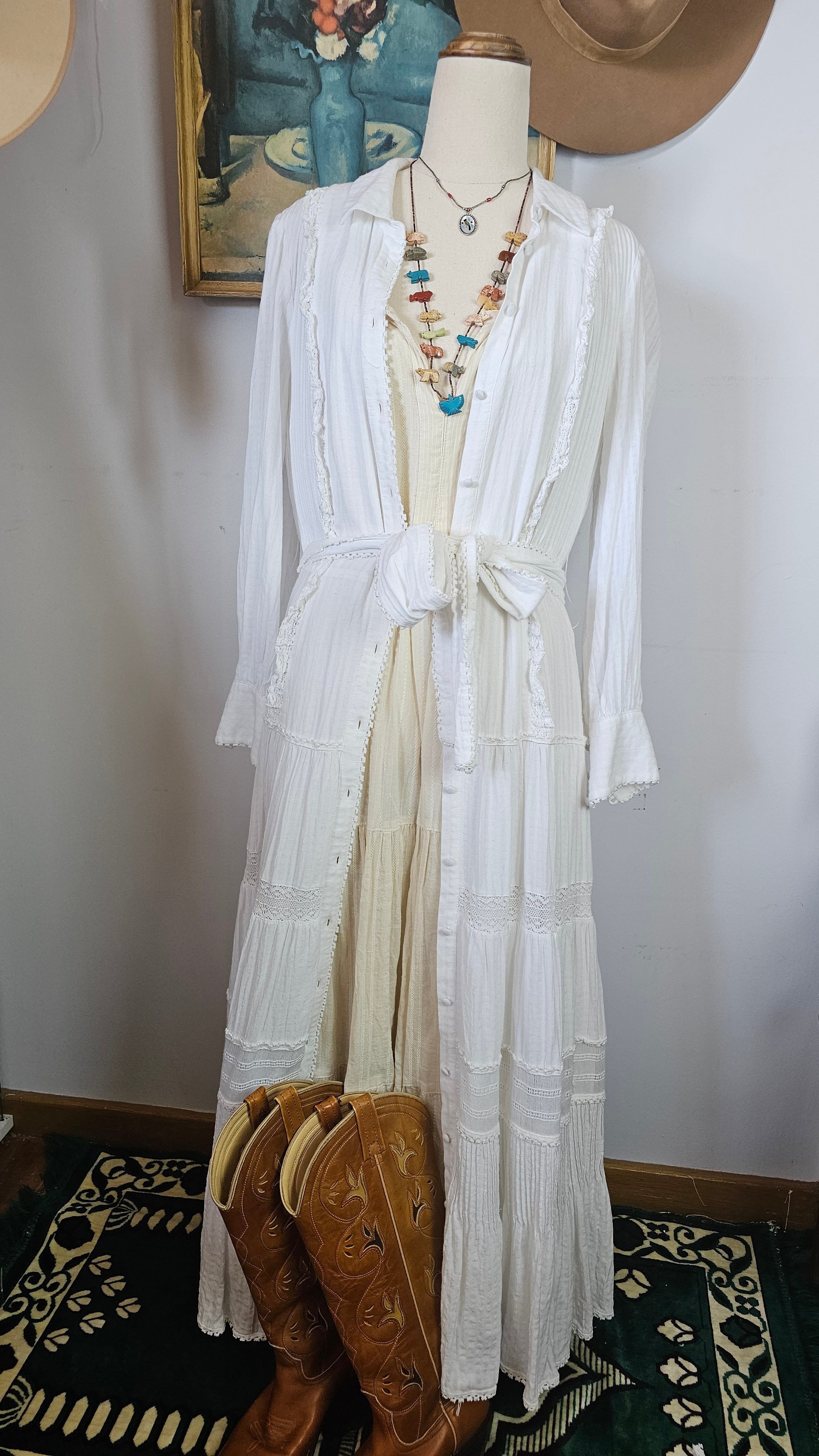 White fabric on a mannequin with decorative elements in the background