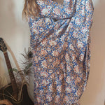 Side view of model in Property of Zephyr – Sienna Long Layer Dress showing flowing tiered silhouette and floral paisley pattern, size small.