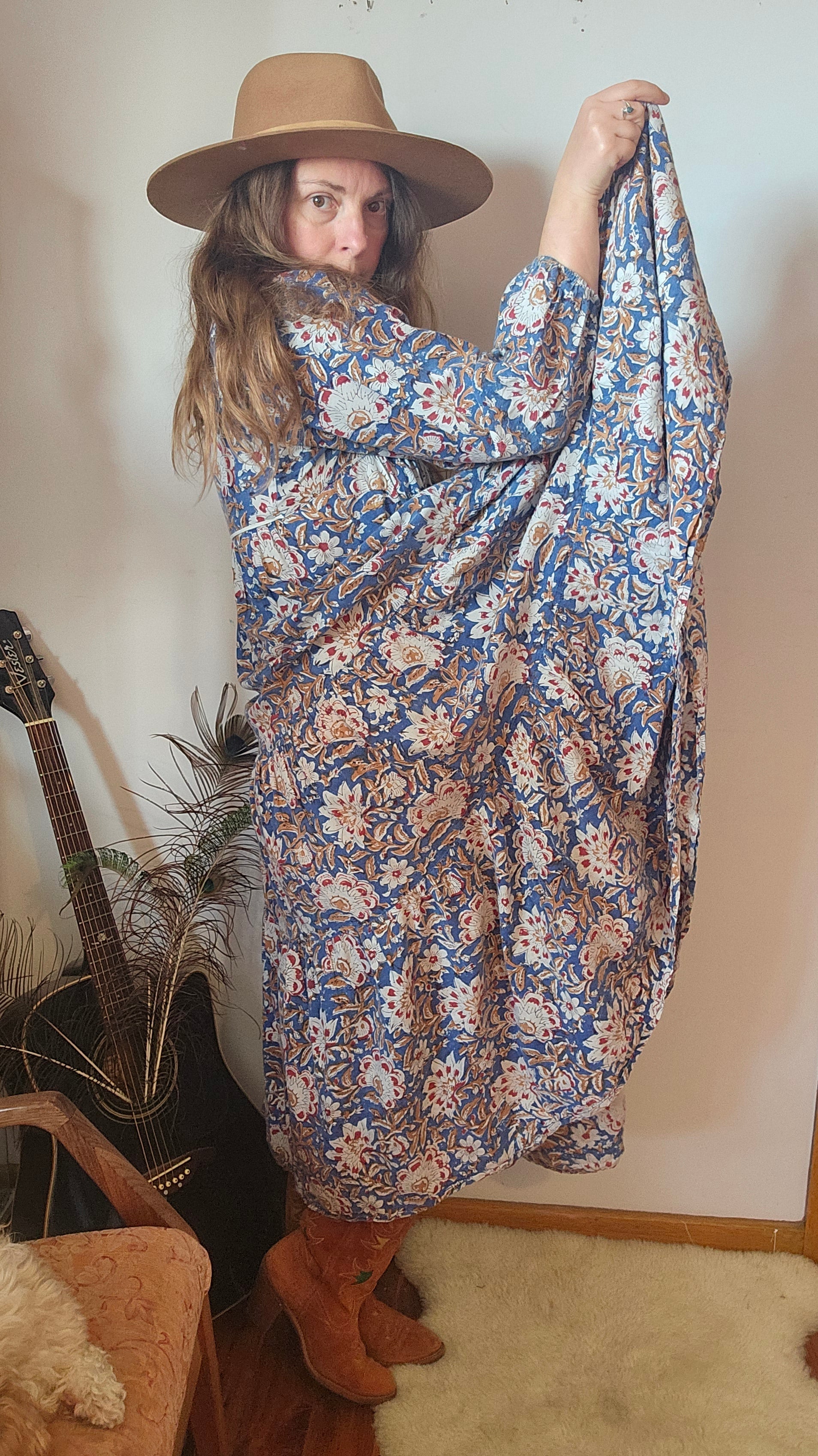 Side view of model in Property of Zephyr – Sienna Long Layer Dress showing flowing tiered silhouette and floral paisley pattern, size small.