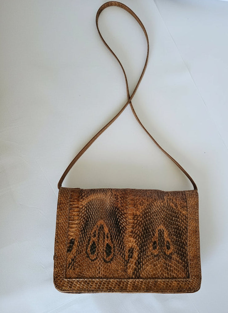 Brown textured handbag on a white background