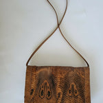 Brown textured handbag on a white background