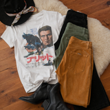 White t-shirt with graphic design, black jacket, green and brown pants on a wooden floor.
