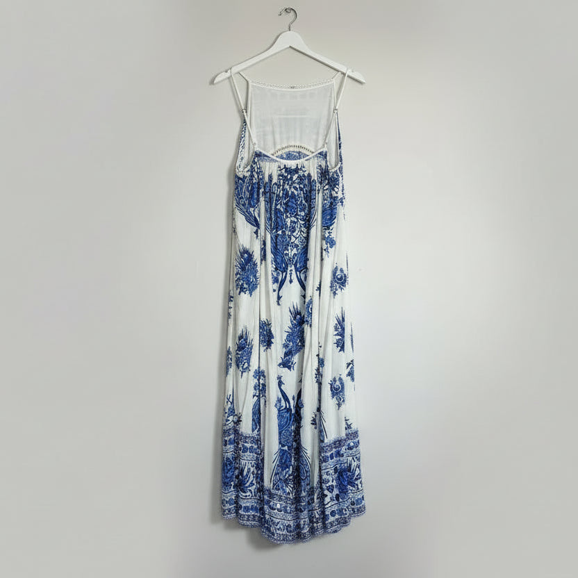 Blue and white floral dress on a white background