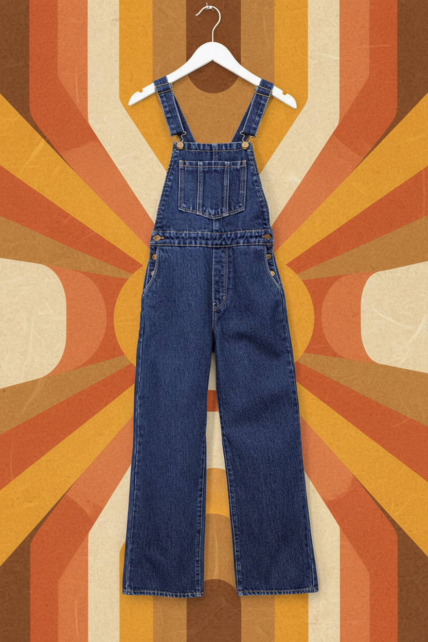 Blue denim overalls on a white background