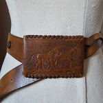 Brown leather belt with embossed design on a light gray background