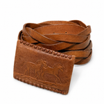 Brown leather belt with embossed design on a white background