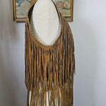 Brown hat with a decorative feather on a white background