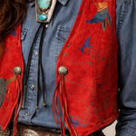 Person wearing a red vintage-style vest with decorative elements and text overlay.