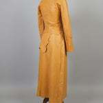 Tan leather jacket on a mannequin against a plain background