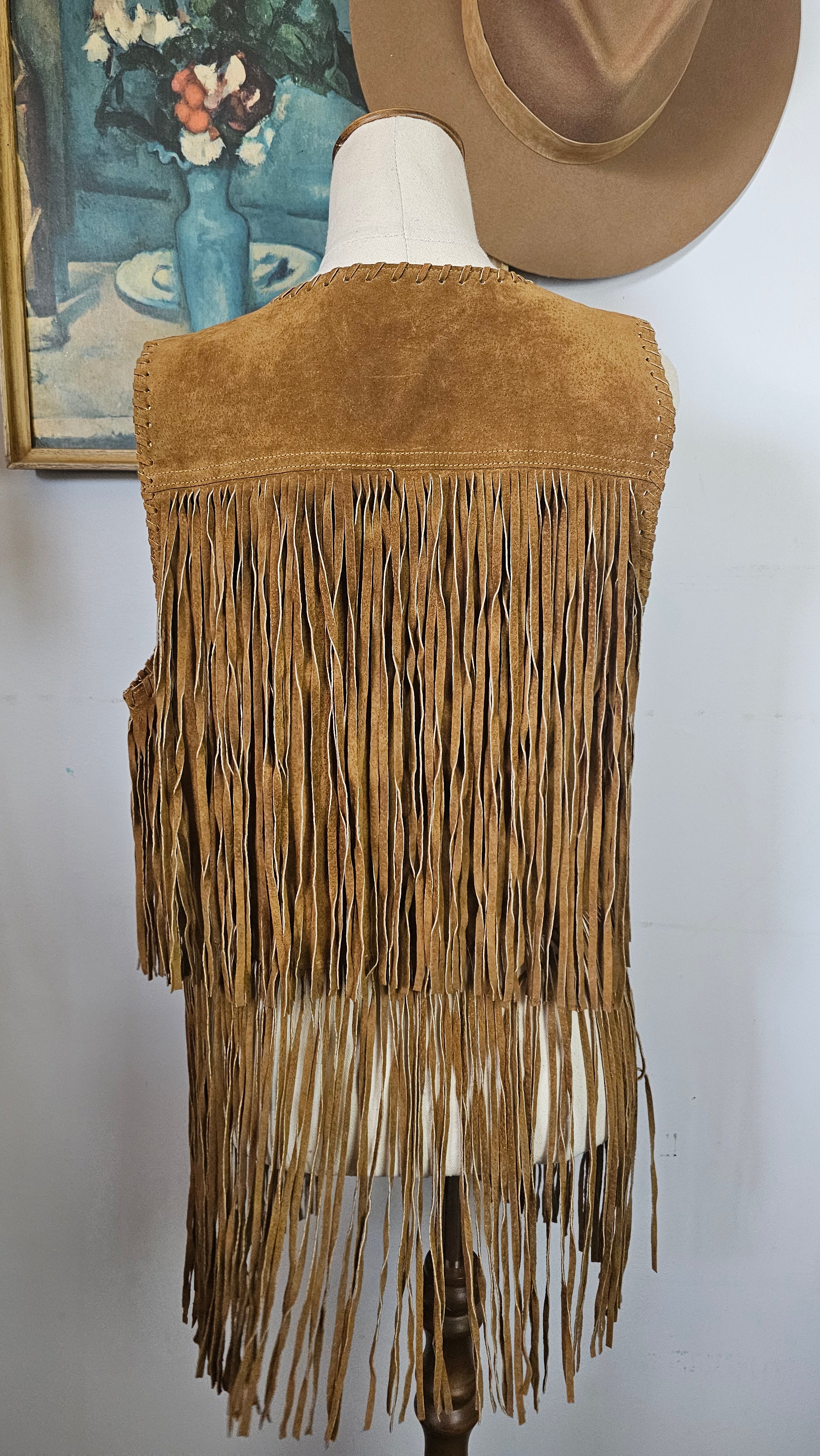 Brown fringed bag on a white background