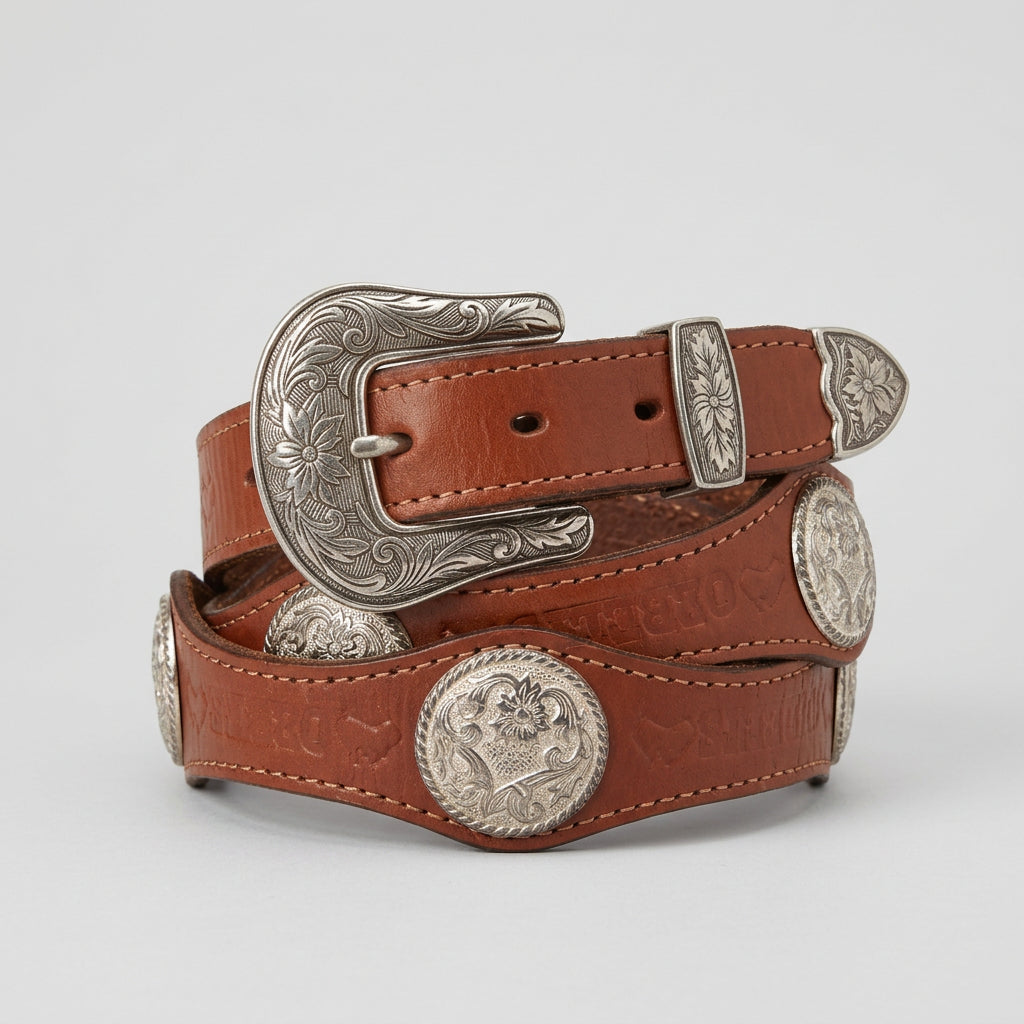 Brown leather belt with silver concho on a white background