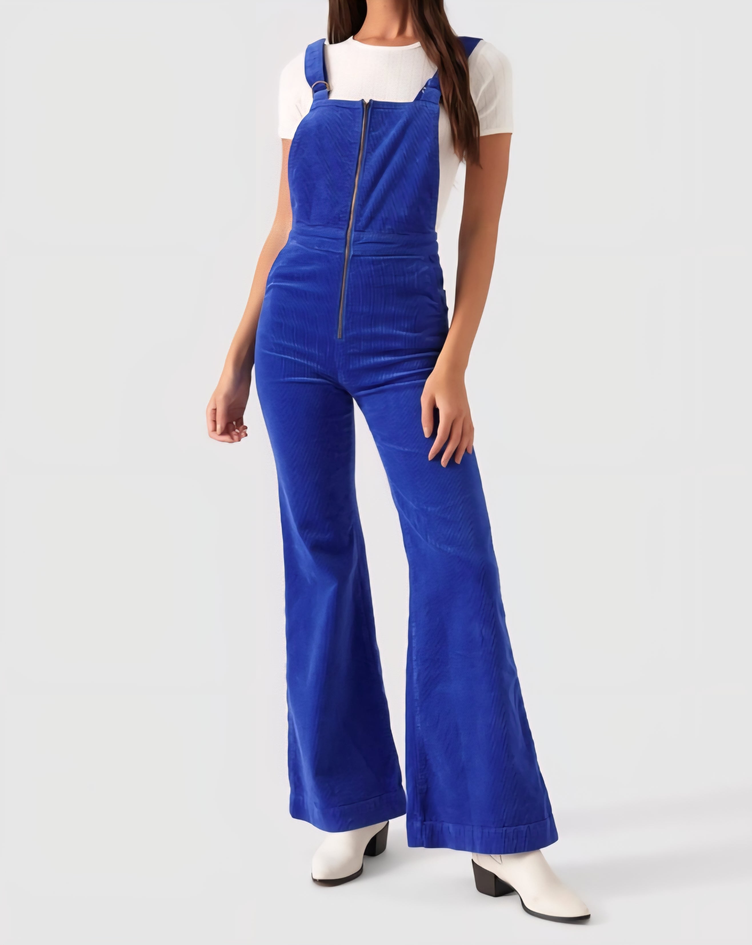 Person wearing a blue jumpsuit on a white background
