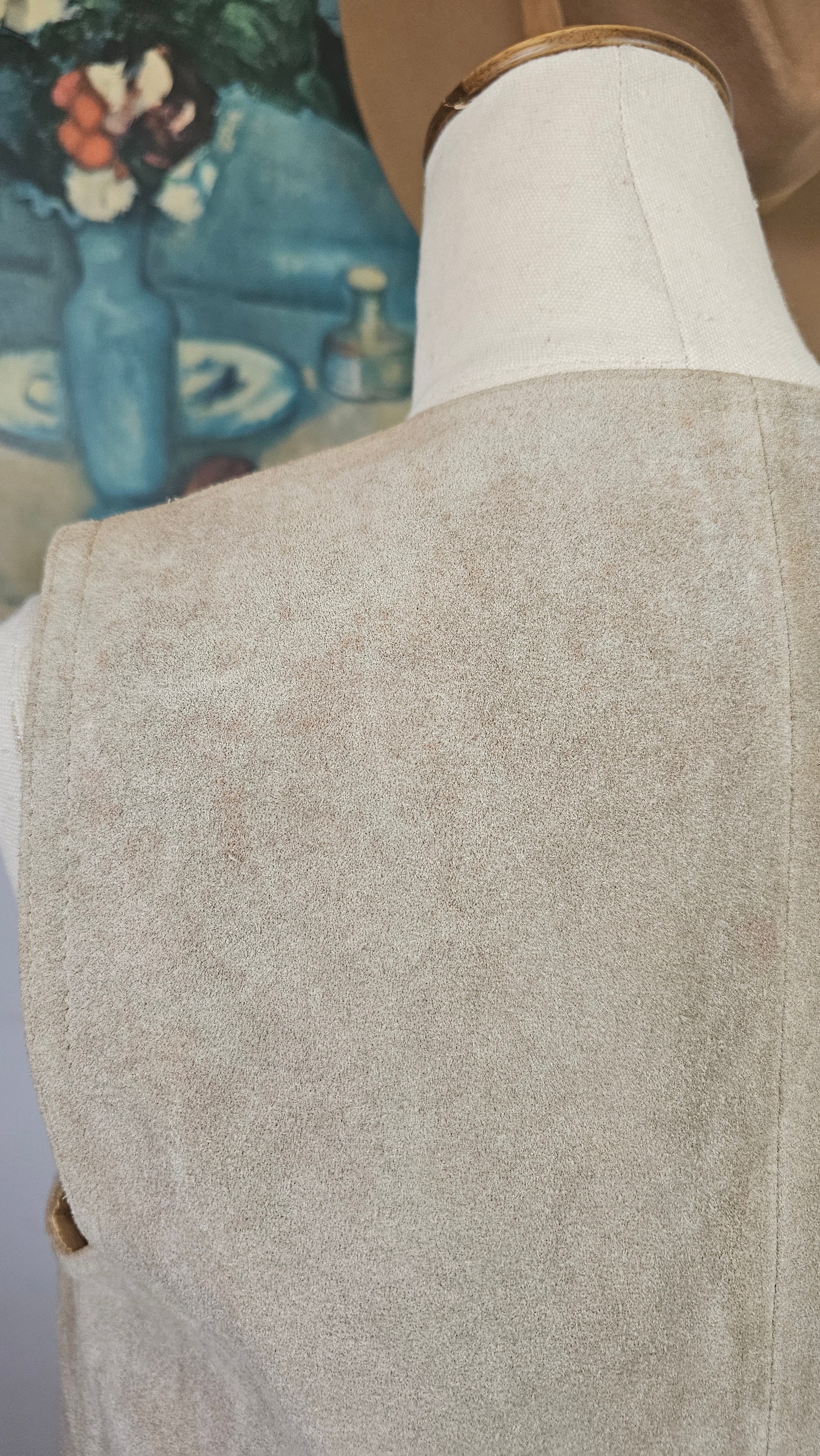 Close-up of a person wearing beige pants and white shoes with a blurred background