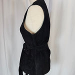 Black velvet headband on a mannequin head against a white background