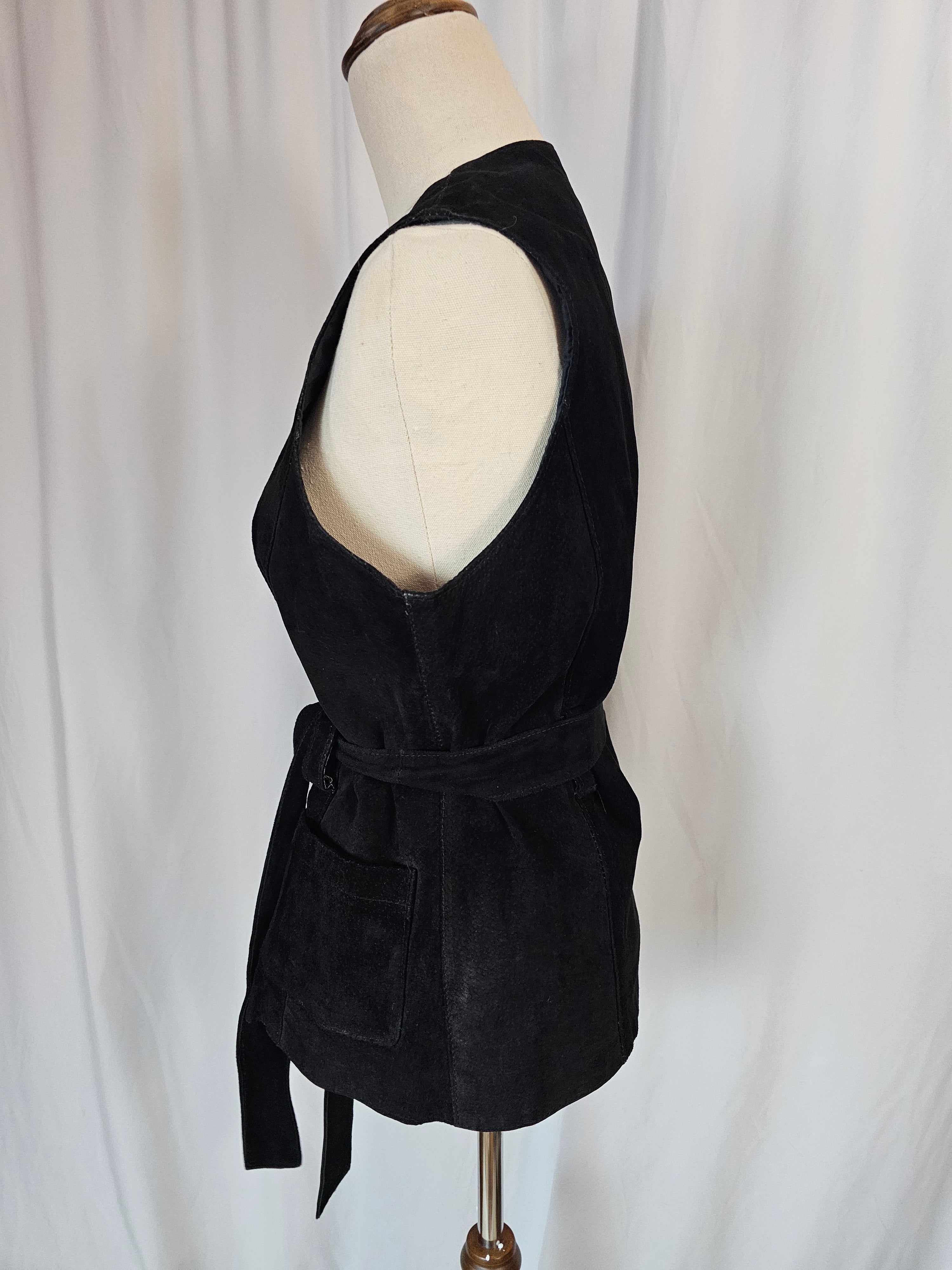 Black velvet headband on a mannequin head against a white background