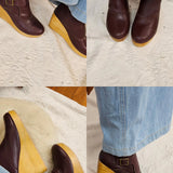 Brown wedge shoes with yellow soles worn with blue jeans on a light background