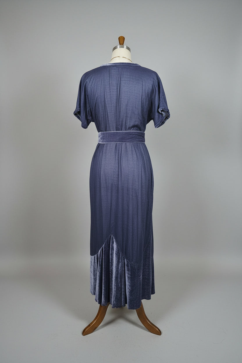 Blue chasing unicorns 
dress on a mannequin against a neutral background