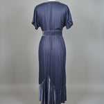 Blue chasing unicorns 
dress on a mannequin against a neutral background