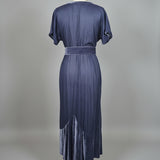 Blue chasing unicorns 
dress on a mannequin against a neutral background