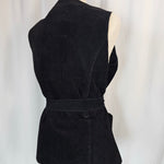 Black strapless top with a large bow on a white background
