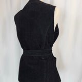 Black strapless top with a large bow on a white background