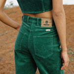 Person wearing green Wrangler pants 