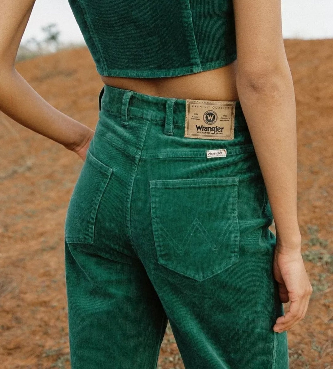 Person wearing green Wrangler pants 