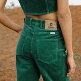 Person wearing green Wrangler pants 
