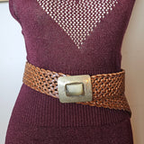 Maroon sweater with a brown belt and metal buckle on a white background