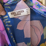 Floral-patterned product with a visible label on a wooden surface