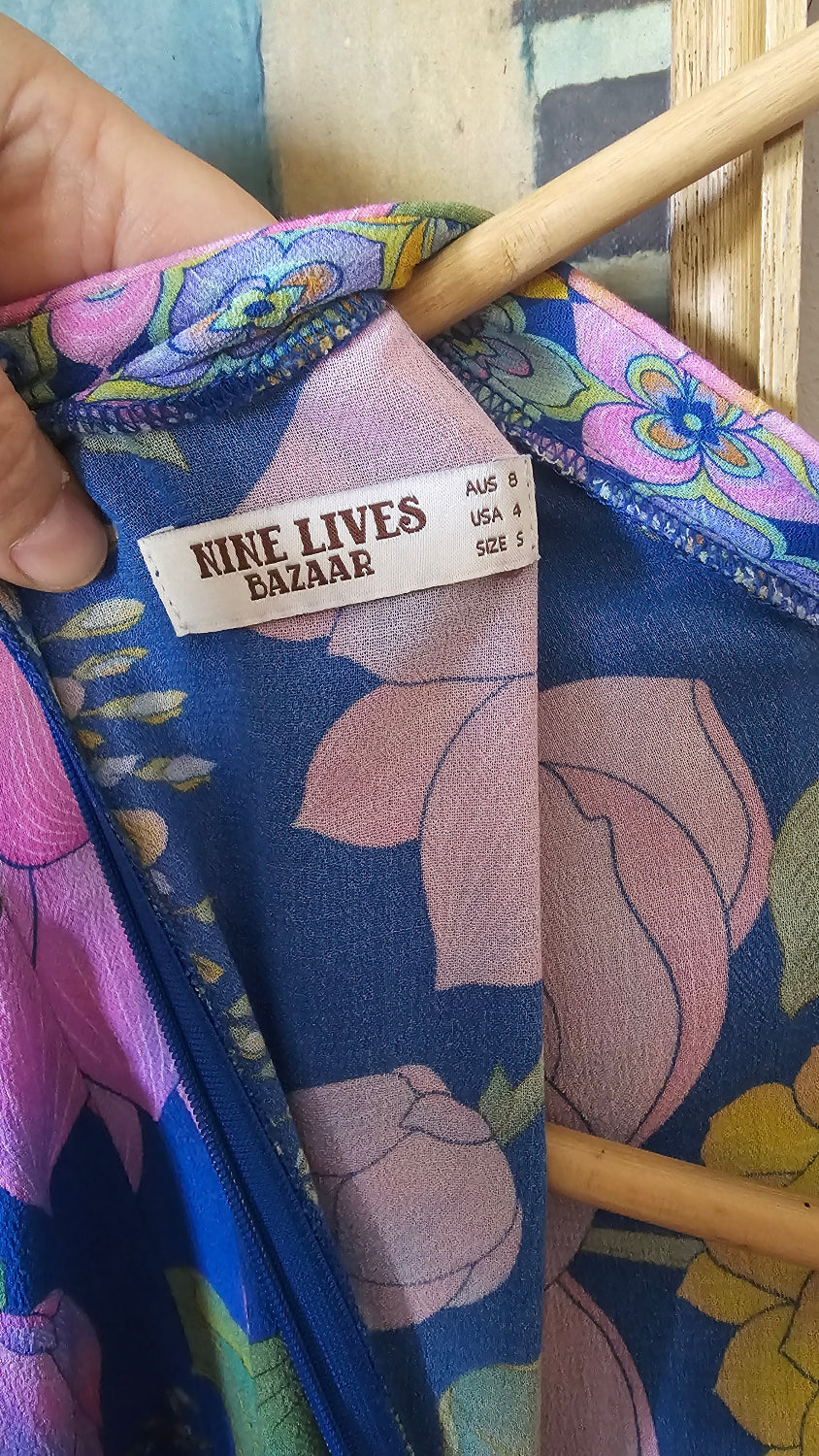 Floral-patterned product with a visible label on a wooden surface