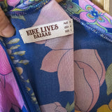 Floral-patterned product with a visible label on a wooden surface