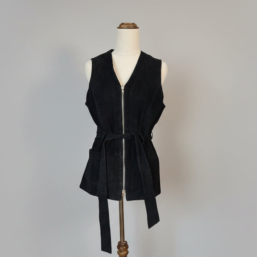 Black dress on a mannequin against a white background