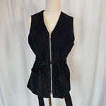 Black dress on a mannequin against a white background