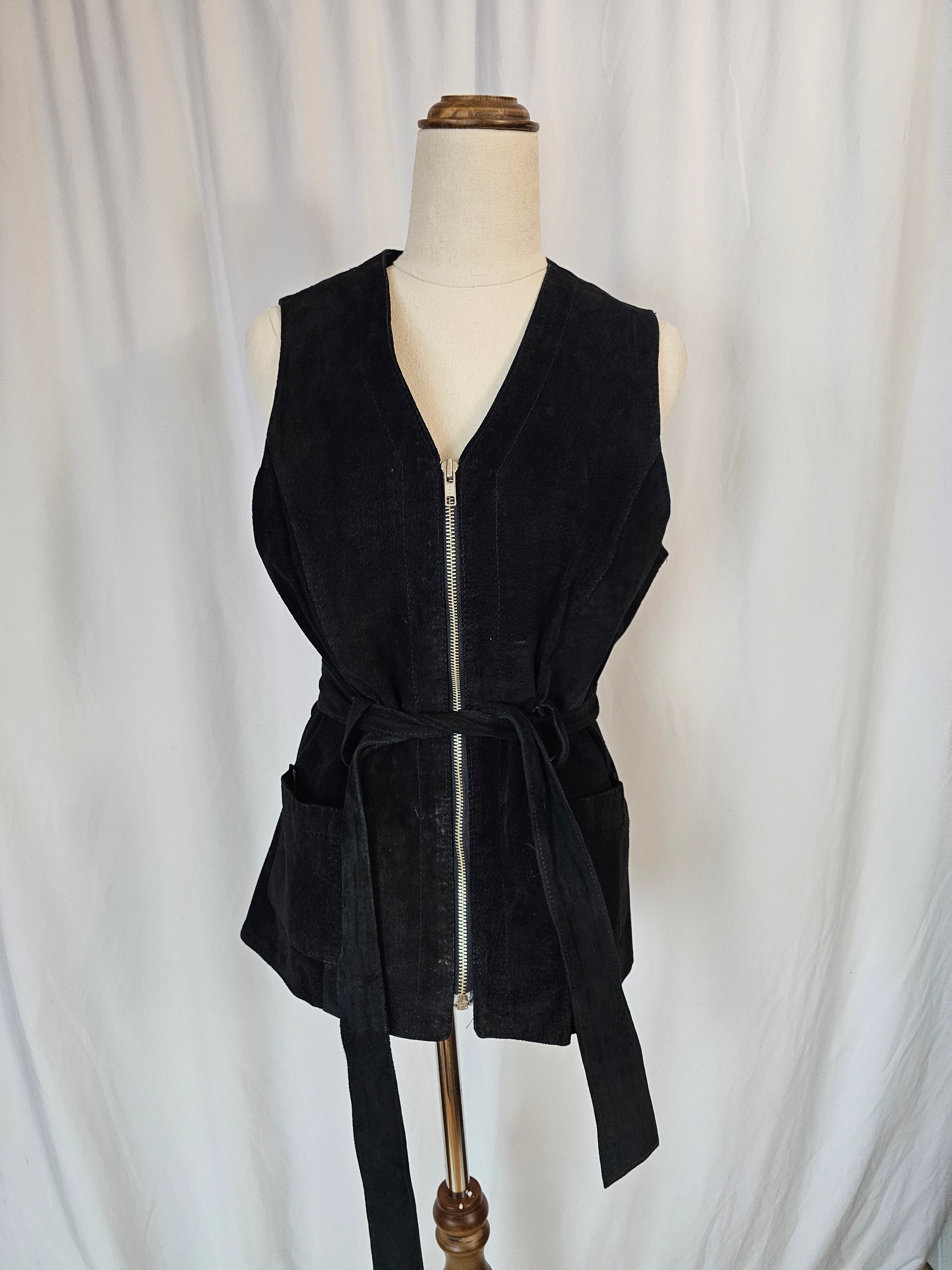 Black dress on a mannequin against a white background