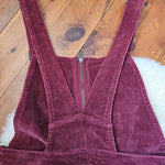 Purple corduroy jacket on a wooden floor