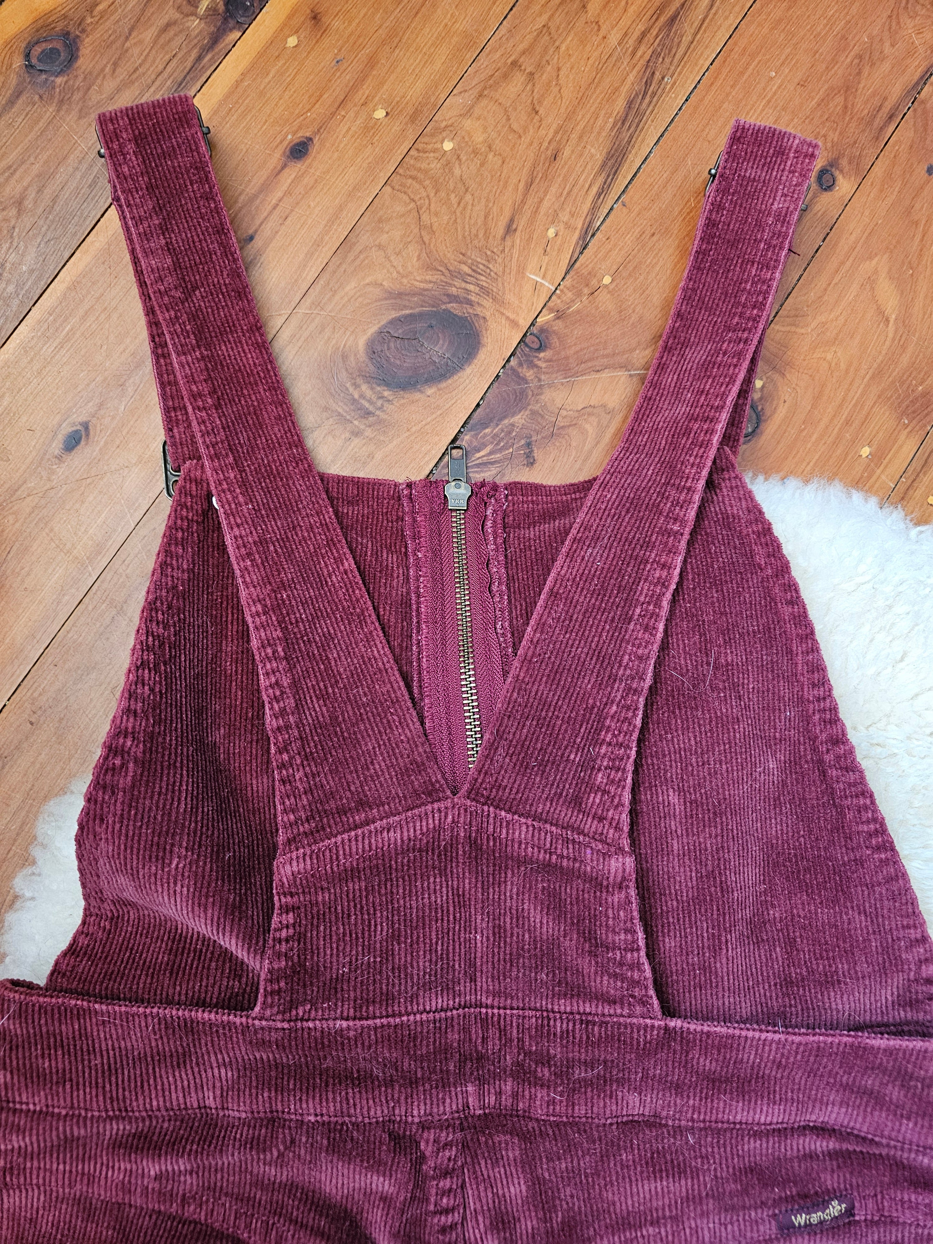 Purple corduroy jacket on a wooden floor