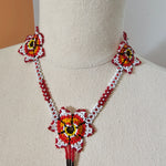 Decorative headband with floral designs on a beige background